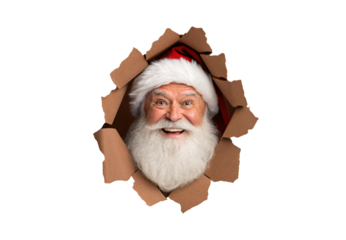 Happy Santa Claus bursting through ripped cardboard hole with cheerful smile and red hat, isolated on a transparent background