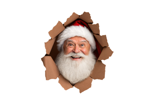Happy Santa Claus bursting through ripped cardboard hole with cheerful smile and red hat, isolated on a transparent background