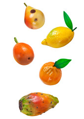 traditional sicilian frutta martorana, marzipan fruits isolated on a pure transparent background, featuring lemon, orange, pear, and prickly pear sweets.
