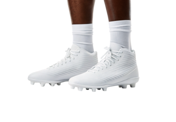 White high-top football cleats with molded studs worn with white athletic socks, isolated on a transparent background