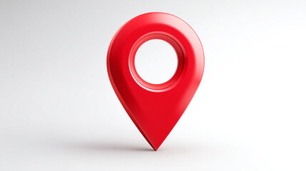 A red location pin standing on a white surface in a studio setting with shadows
