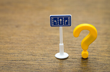 Navigating Life's Questions: A road sign and a question mark combine to symbolize the uncertainty, doubt, and the process of seeking answers for one's path