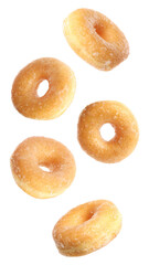 five classic glazed ring donuts captured floating and tumbling in a dynamic mid-air composition against a solid transparent background.
