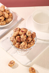 Dried Jujube Dates from Xinjiang China in Glass Bowl with Tea Cup Healthy Traditional Snack Food