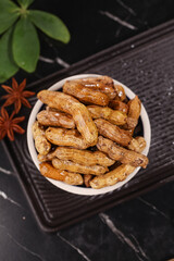 Spicy Marinated Peanuts with Garlic Seasoning in White Bowl - Asian Appetizer Snacks