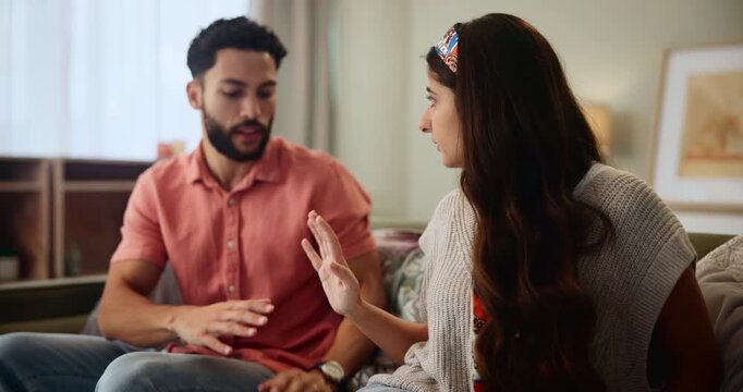 Couple, disagreement and relationship or fight in home, conflict and breakup or talking with hand gesture. Woman, upset and frustrated with cheating partner on sofa, problem and sympathetic man