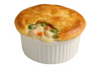Chicken pot pie creating a warm comfort food meal, featuring flaky golden crust and creamy vegetable filling in a ramekin