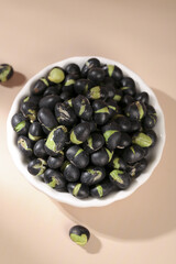 Crispy Fried Black Beans with Green Salt Seasoning in White Bowl - Healthy Snack Food