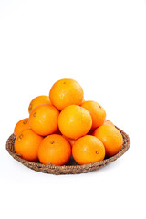 Fresh Sweet Navel Oranges in Wicker Basket on White Background