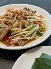 Som tum Thai (papaya salad) with Grilled pork collar.