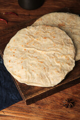 Fresh Homemade Tortillas on Wooden Board - Traditional Flatbread Cooking Preparation