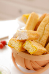 Delicious Fresh Corn Fritters with Crispy Golden Batter in Wooden Basket