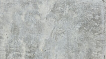 Gray polished cement wall. The gray wall has cracks and different shades of color. Industrial loft style grey cement wall texture. Concrete wall texture background.
