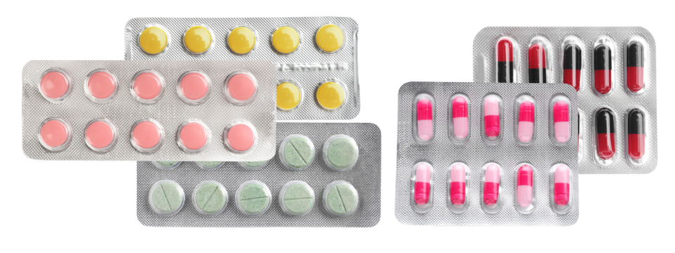 overlapping arrangement of diverse blister packs containing various colored pills, including pink tablets, yellow tablets, and multi-colored capsules, isolated on black.