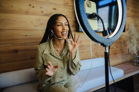 Female creator engages with audience while recording content