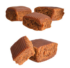 a photograph featuring four rich, chewy, brown cubes of traditional crumbly fudge or soft caramel toffee candy isolated on black.