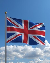 The union jack flag of the united kingdom waving in a blue sky with clouds