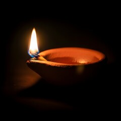 Traditional Clay Lamp (Pahana) with Isolated Flame on Dark Background, Spiritual Ambiance