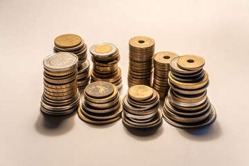 Stacks of diverse coins representing global finance and currency