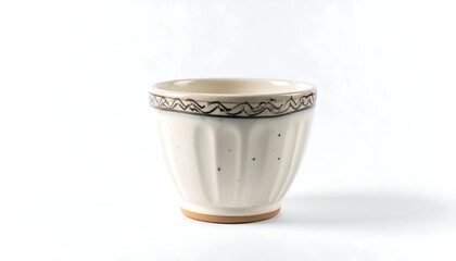 Close-up of a small, cream-colored ceramic cup on a white background