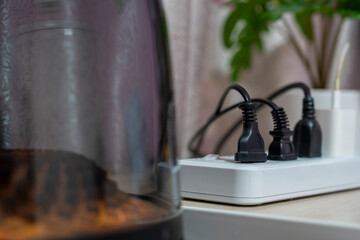 Close-up, Various types of power plugs are plugged into extension sockets.