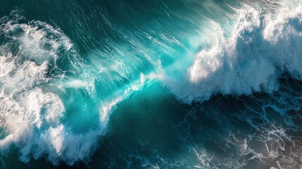 Turquoise waves crash against a rocky shore, showcasing the beauty of the ocean at sunset