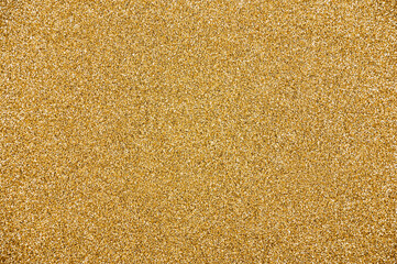 Abstract shiny gold glitter background.