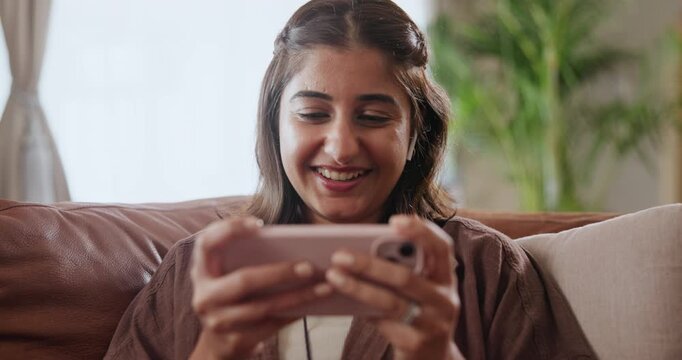 Woman, smartphone and online stream with internet, browse and social media for networking. Student, technology and laughing for relaxation, video and podcast for break in living room with music