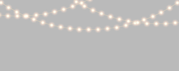 Christmas lights with glowing bulbs. Bright garland decoration for holiday. Gold Christmas and New Year bright garlands, led light strips © dlyastokiv