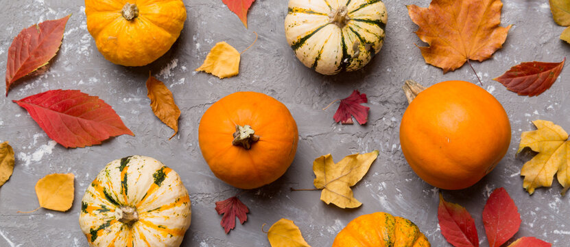 Autumn composition. Pattern made of dried leaves and other design accessories on table. Flat lay, top view