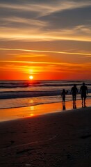 Family Silhouettes on Beach at Sunset with Vibrant Orange Sky.