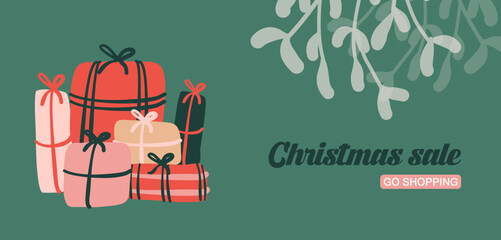 D&eacute;corations de No&euml;l et cadeaux sur fond vert, avec branche de gui. Cadre et banni&egrave;re de No&euml;l pour le th&egrave;me des f&ecirc;tes de fin d'ann&eacute;e. Illustrations vectorielles