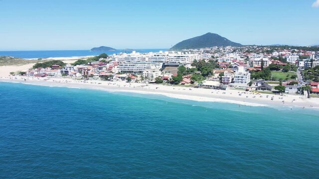 Panoramic aerial view of Ingleses beach in Florianópolis, Santa Catarina, an urban complex on the coast, city master plan, neighborhoods and real estate developments facing the sea.