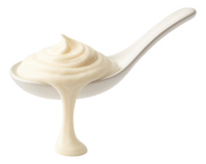 Creamy mayonnaise dollop elegantly drips from a ceramic spoon.