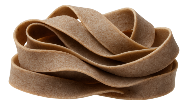 A coil of uncooked whole wheat pasta with a flat, wide shape and rustic texture.