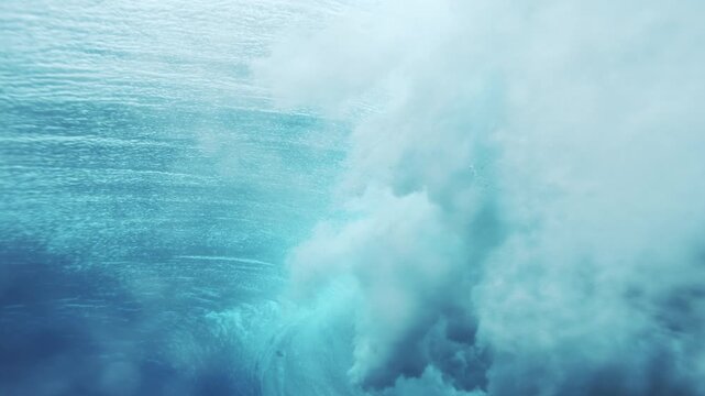 Misty foam dissipates in water revealing cloud like mess of vortex at Cloudbreak Fiji