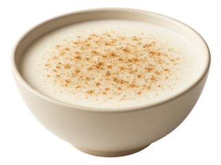 A wide-rimmed bowl of cashew milk, with a pinch of ground nutmeg sprinkled on top.