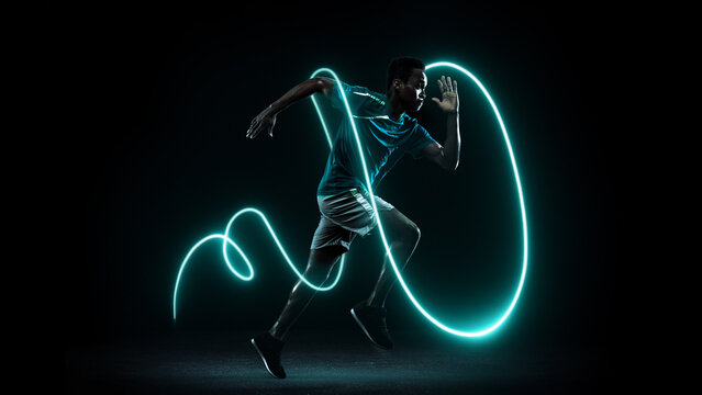 Sprinter running with glowing neon trail representing speed and motivation. Concept of fitness app promotion, sports tech branding, and active lifestyle advertising.
