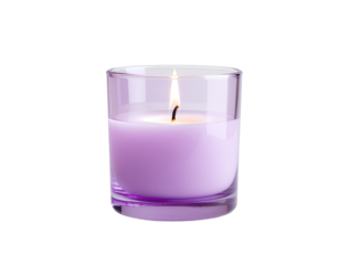A lit lavender scented candle in a clear glass jar with a black background and a small flame casting a warm glow
