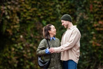 Happy young couple dating in nature park