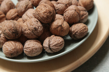 Rustic image of dry walnuts in a bowl	