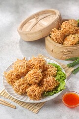 Udang Rambutan. Rambutan Shrimp is a type of fried dimsum, ball-shaped and filled with chopped chicken and shrimp.