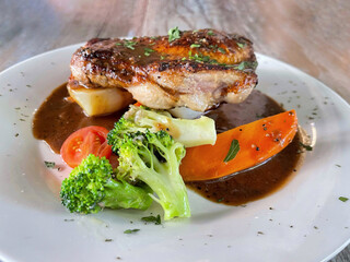 Display of chicken chop menu on wooden table. Food and drink concept.