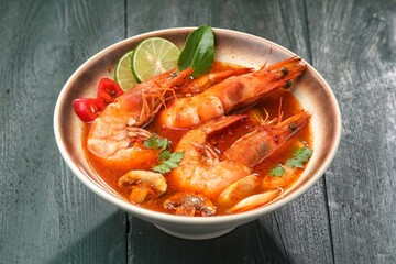 Tom yum goong or tom yam is a family of hot and sour Thai soups