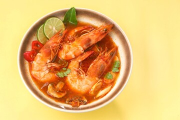 Tom yum goong or tom yam is a family of hot and sour Thai soups