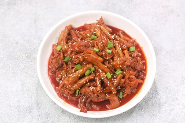 Dakbal (닭발) is a Korean dish made from chicken feet, often spicy, sweet, and chewy, which is popular as a snack or street food.