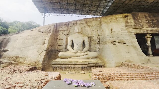 Ancient Gal Viharaya rock temple in Polonnaruwa Sri Lanka with carved Buddha statues