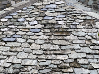 Traditional slate roof detail with overlapping stones