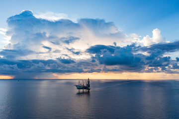 Obraz premium Offshore jack up rig in aerial view in the middle of the ocean taken by a drone