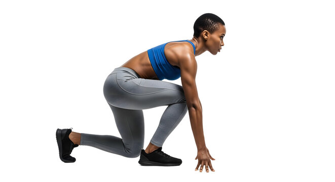 Athletic woman in sportswear in starting position ready for a race or workout, fitness and training concept